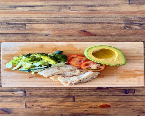 Fresh vegetables and grains on a wooden table symbolizing balanced diet